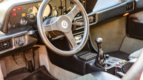 A manual transmission in a 1970s BMW M1, which aren't seen in electric vehicles (EVs)