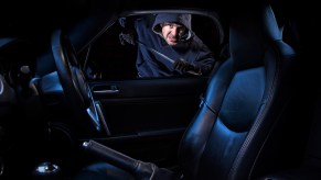 Carjacking thief breaks into car late at night with a crowbar