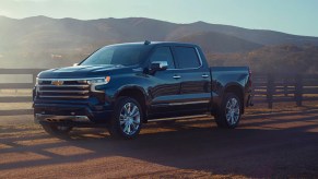 A blue Chevrolet Silverado 1500 truck is parked.