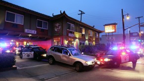 CHP officers and Long Beach police officers investigating at the end of a chase