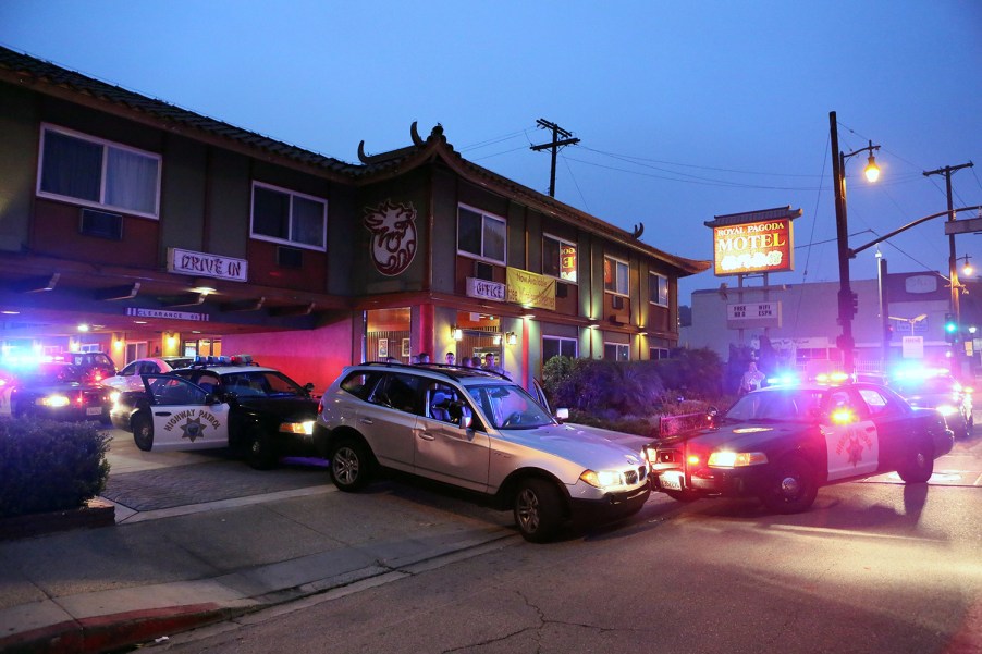 CHP officers and Long Beach police officers investigating at the end of a chase