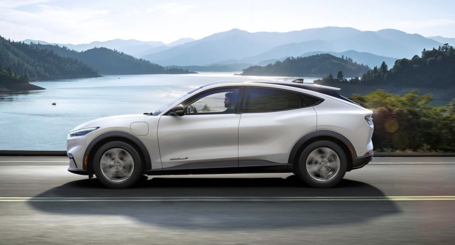 The side of a white 2022 Ford Mustang Mach-E electric SUV.