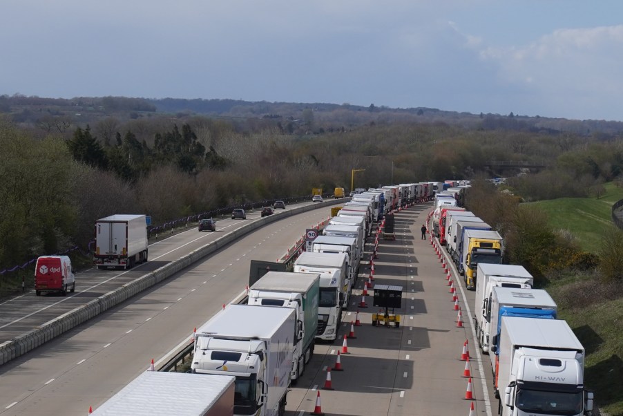 Semi trucks are backed up along a highway, What is the #NoTruckstoColorado TikTok Trend?