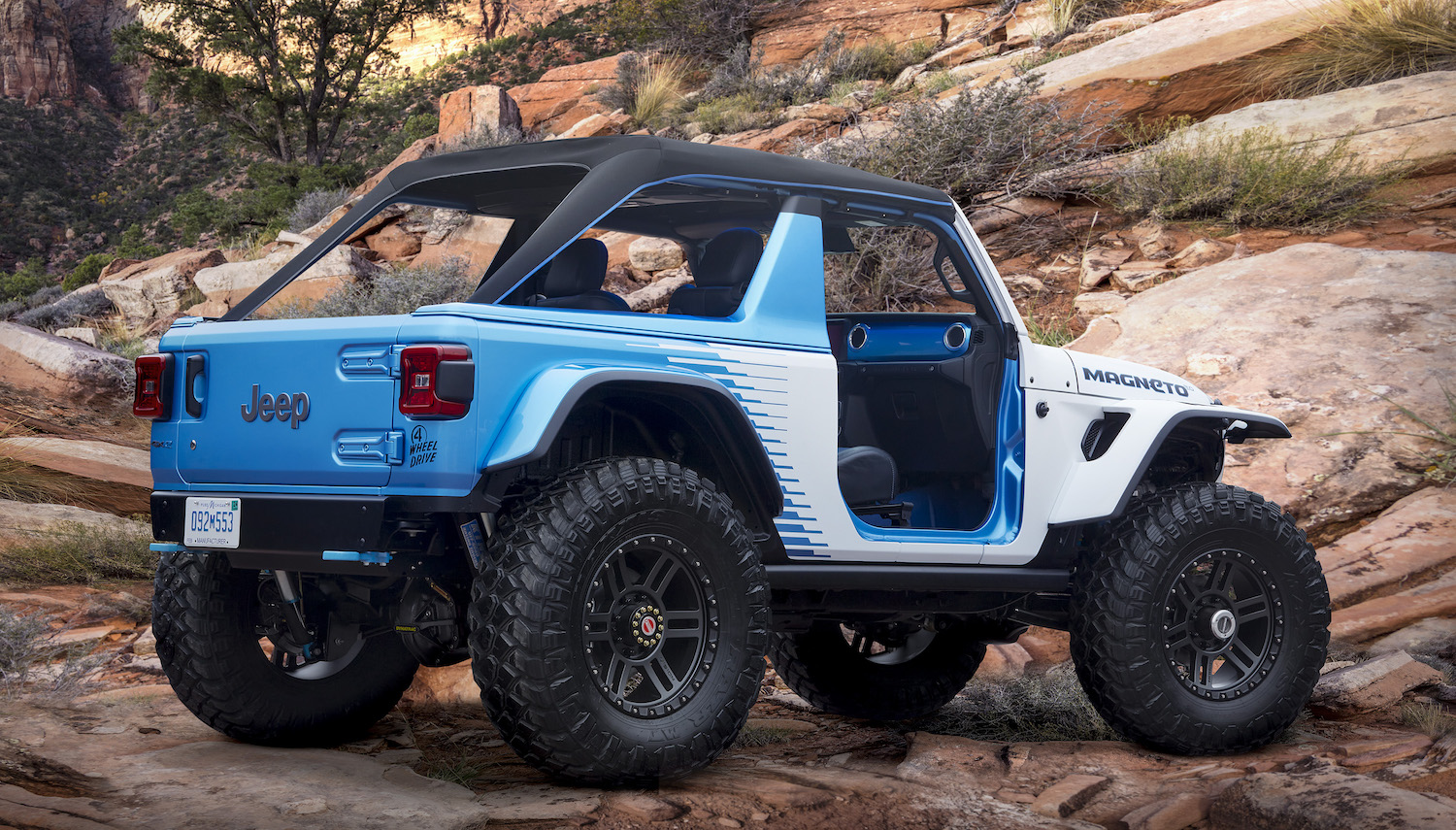 An electric Jeep concept vehicle parked on a rocky mountainside.