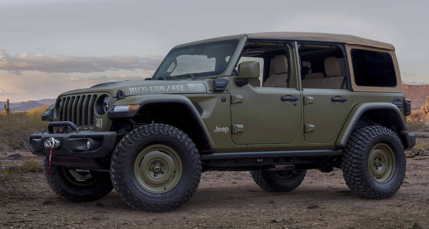 Khaki green, retro Jeep Wrangler plug-in hybrid concept car parked in the desert.