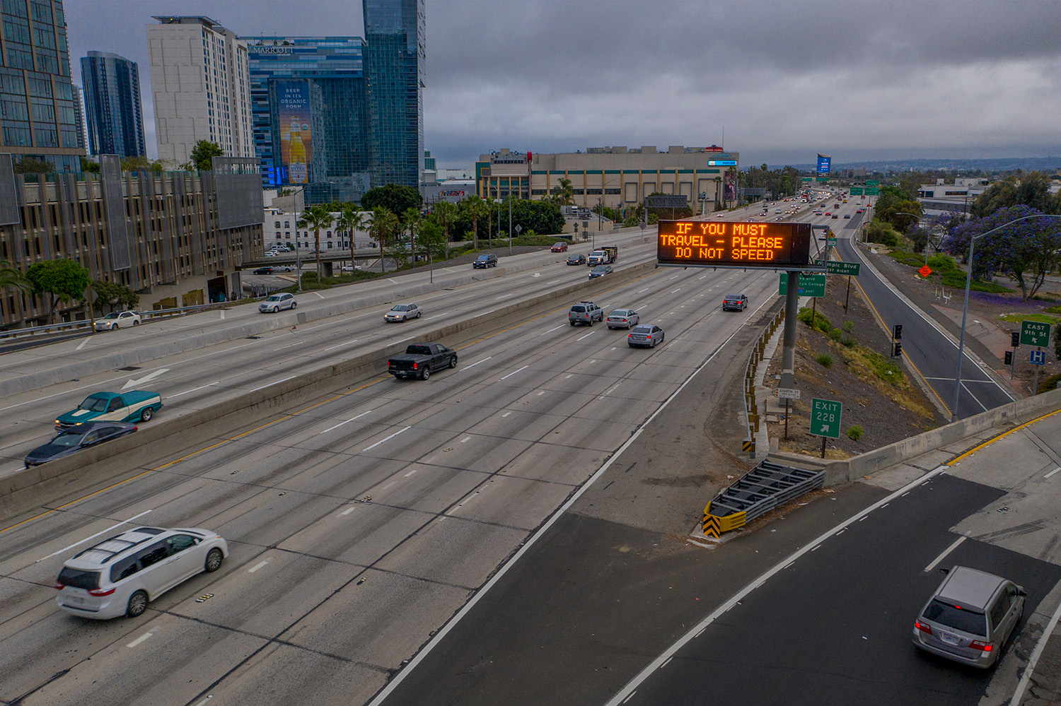 California Highway sign displaying message about safety and driving, urging drivers not to speed