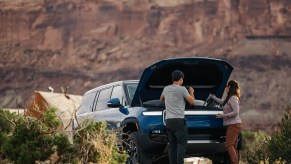 Rivian R1S owners using its frunk. Battery power and charging times are great for the electric SUV.