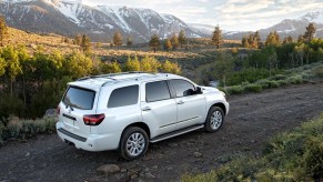 A white 2022 Toyota Sequoia driving in front of mountains.