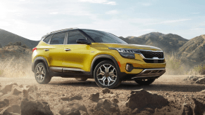 Starbright Yellow 2022 Kia Seltos parked near some rocks