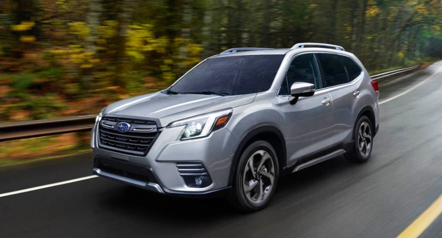 A silver 2022 Subaru Forester drivin