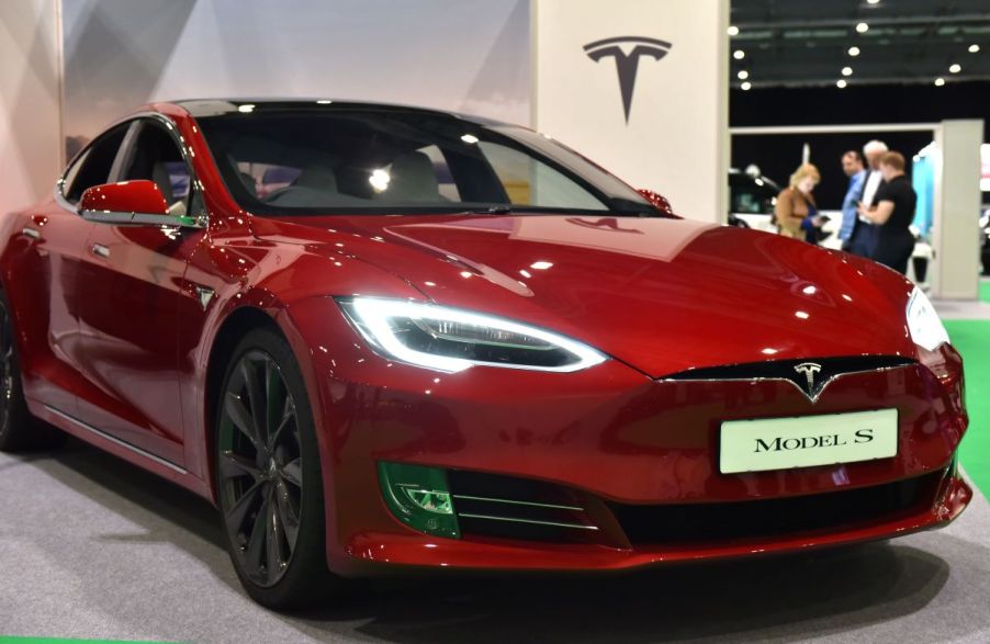 A red Tesla Model S, capable of instant torque.