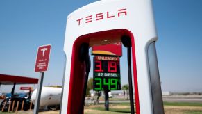 A Tesla Supercharger seen at a gas station at a highway exit in Ehrenberg, Arizona