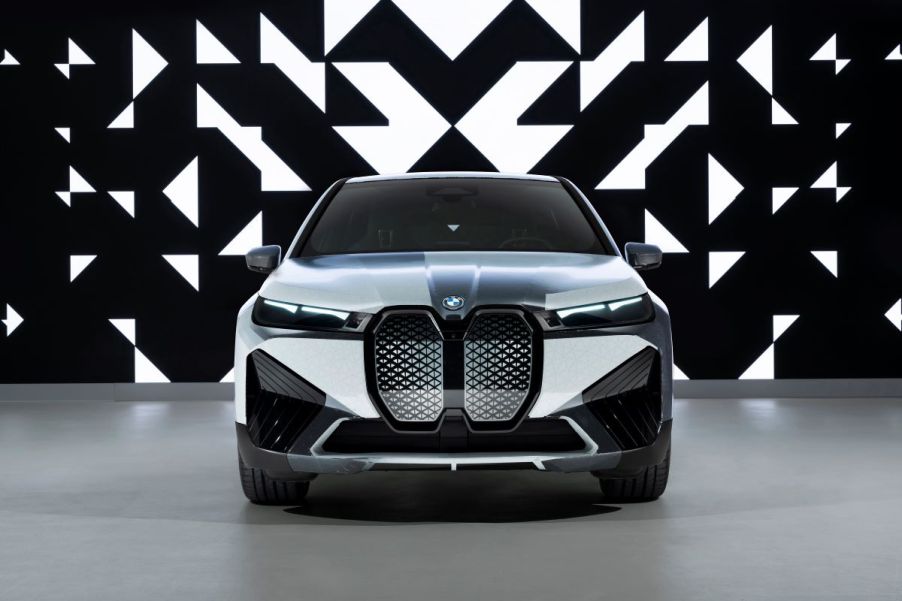 Front end of the color-changing paint on the BMW iX M60 SUV. Black and white body panels compliment the black-and-white abstract background