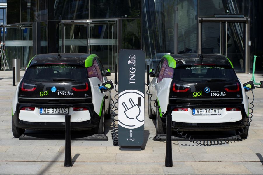 BMW i3 EV models charging at an electric vehicle charging station