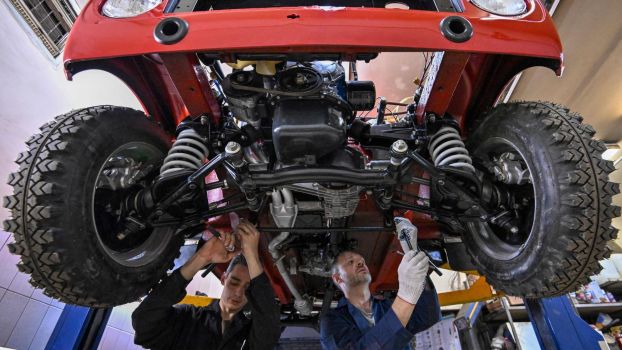 Performing car maintenance on a Lada Niva in Tolyatti, Russia