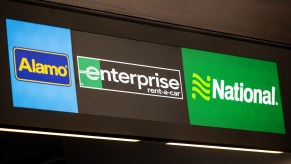 An Alamo Enterprise rent a car National sign seen at the