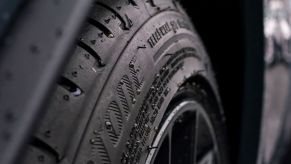 Close-up of a car tire; car tire pressure should be neither too high nor too low