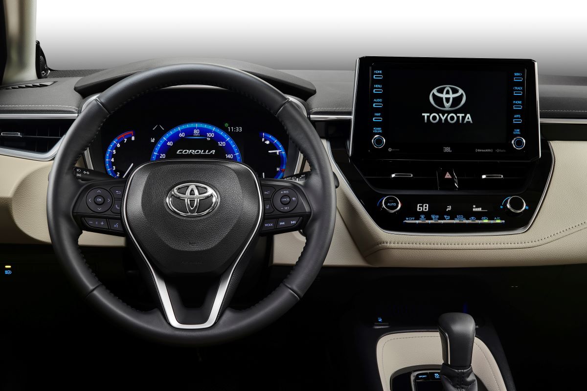 Used 2020 Toyota Corolla sedan interior in black and tan