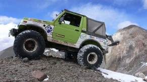 Green 1986 Suzuki Samurai parked atop a mountain in Chile.