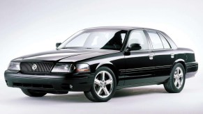 A black 2003 Mercury Marauder in a gray studio