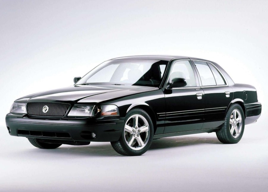 A black 2003 Mercury Marauder in a gray studio