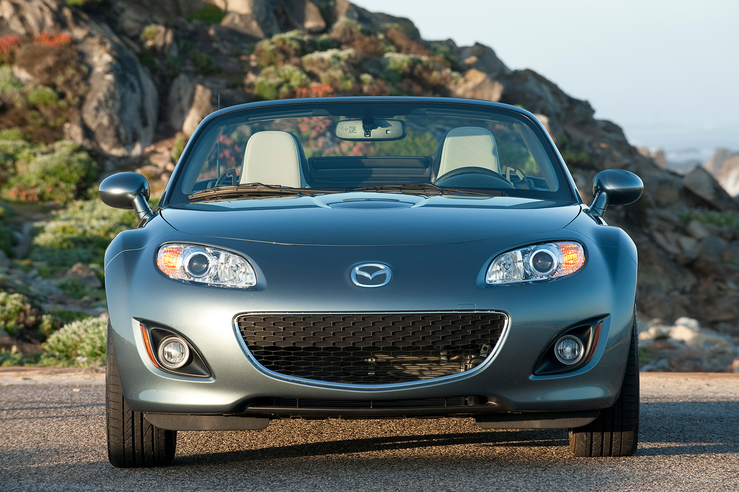 Front end of 2012 Mazda MX-5 NC Miata parked on mountain roadway