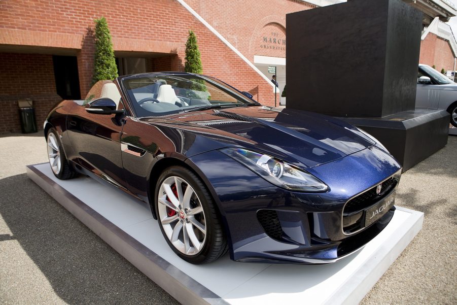 A dark-blue 2014 Jaguar F-Type V8 S Convertible on a plinth at Goodwood