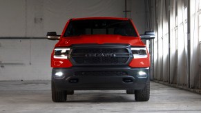 Red Ram 1500 pickup truck parked inside a garage.