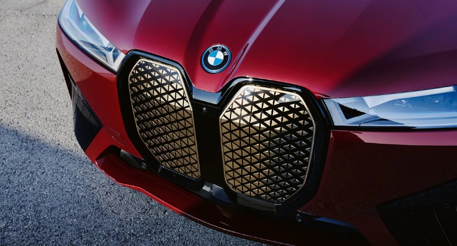 The front of a red 2022 BMW iX electric SUV.