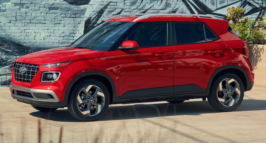 A red 2022 Hyundai Venue subcompact SUV is parked.