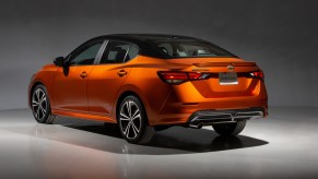 an orange 2022 Nissan Sentra parked under lights