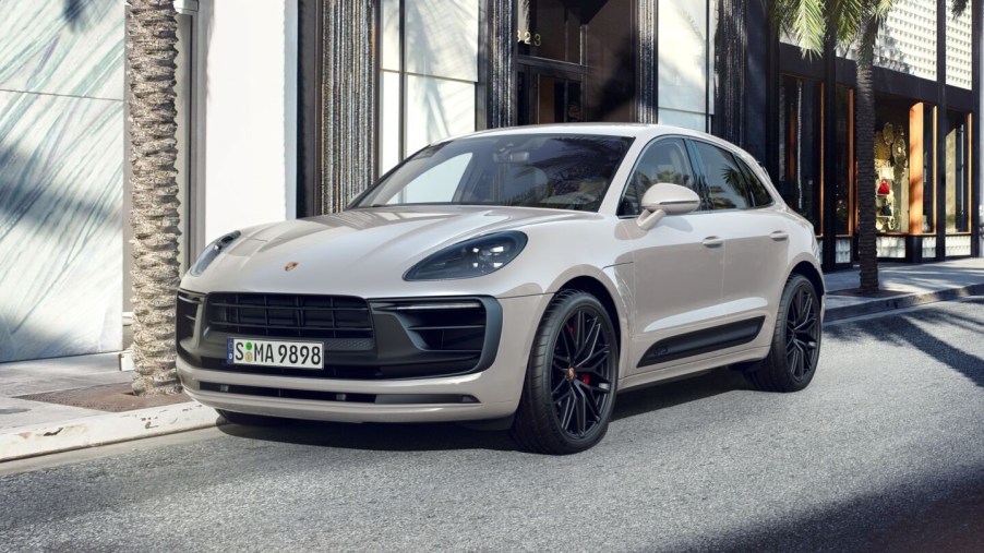 A white 2022 Porsche Macan in a city.