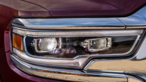 Closeup of the headlight of a 2022 Ram 1500 pickup truck.