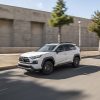 2022 Toyota RAV4 Off Road in white driving on a road