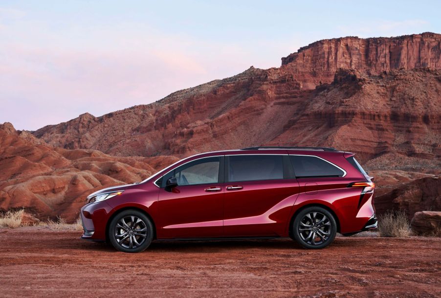 A red 2022 Toyota Sienna in a desert area.