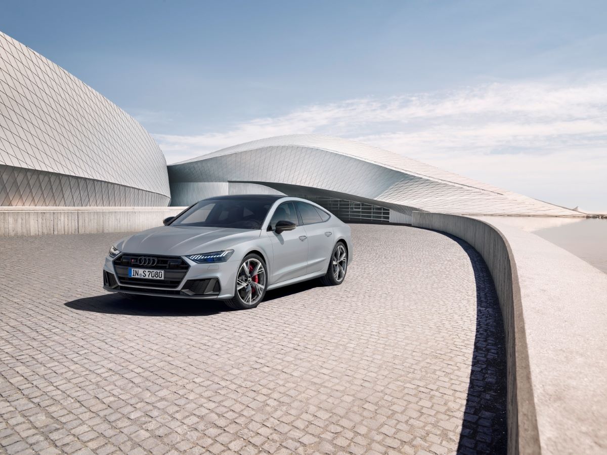 Silver Audi S7 V6 sedan parked on a cobblestone driveway