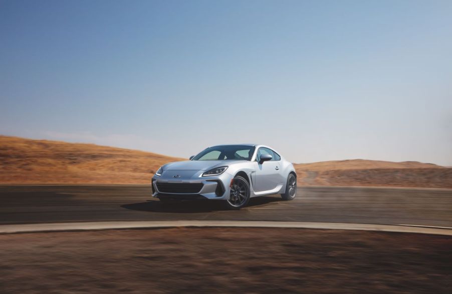 Silver 2022 Subaru BRZ Limited sports coupe drifting around a corner