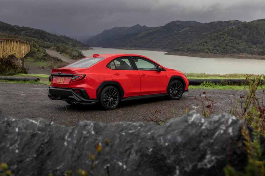 Red Subaru WRX sports sedan, one of the many Subaru models with standard Symmetrical All-Wheel Drive