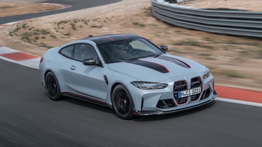 a grey 2023 BMW M4 CSL rips around the track, showing of unique body pieces and aero pieces