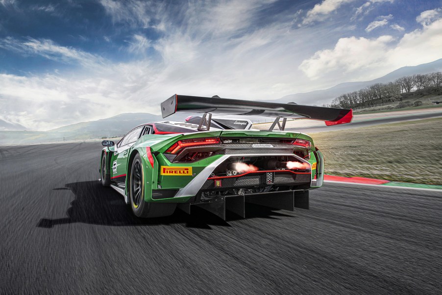 Rear end and flame spitting exhaust from new Lamborghini Huracan GT3 EVO2 STO based supercar race car on track