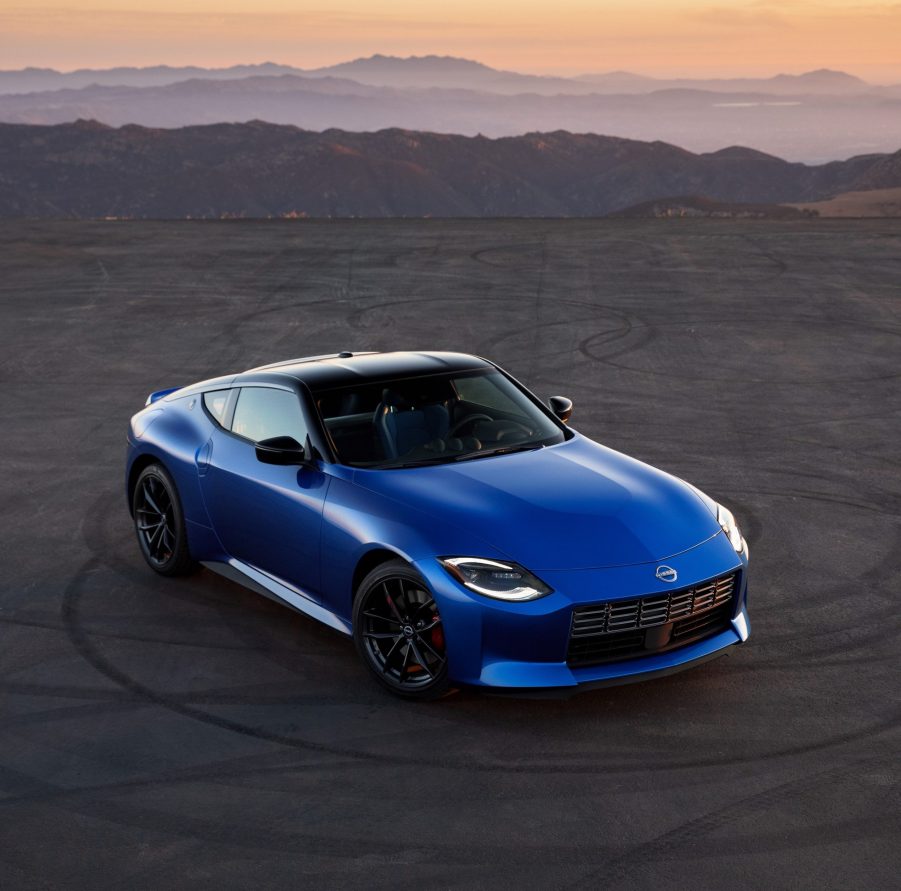 An overhead view of a blue 2023 Nissan Z on a canyon-side parking space