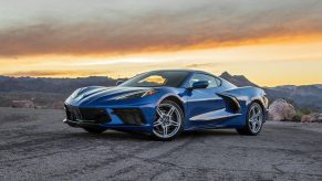 A blue 2022 Chevrolet C8 Corvette Stingray on a desert canyon overlook