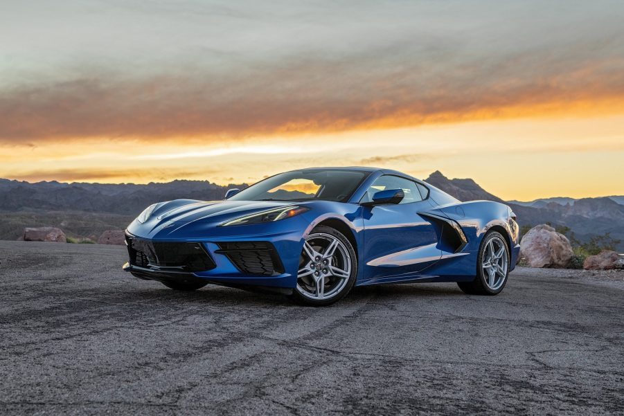 A blue 2022 Chevrolet C8 Corvette Stingray on a desert canyon overlook