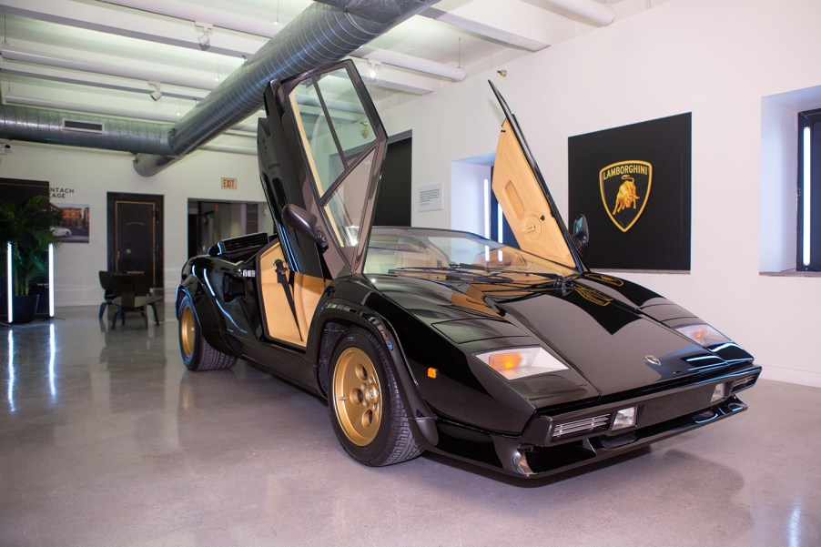 Black Lamborghini Countach with scissor doors up on display at Lamborhgini exhibit