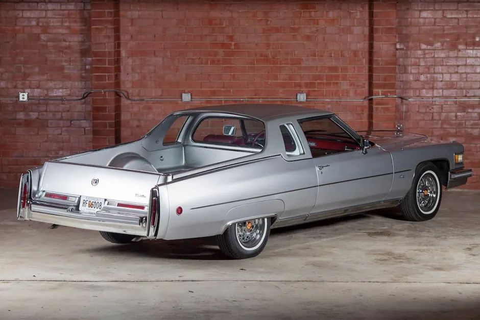 A silver Cadillac Coupe DeVille truck