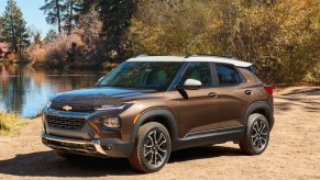 A brown 2022 Chevy Trailblazer against a background of trees.