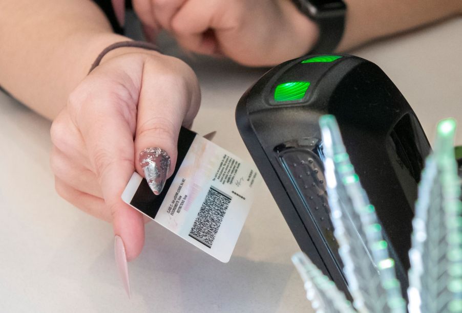 Driver's license being scanned.