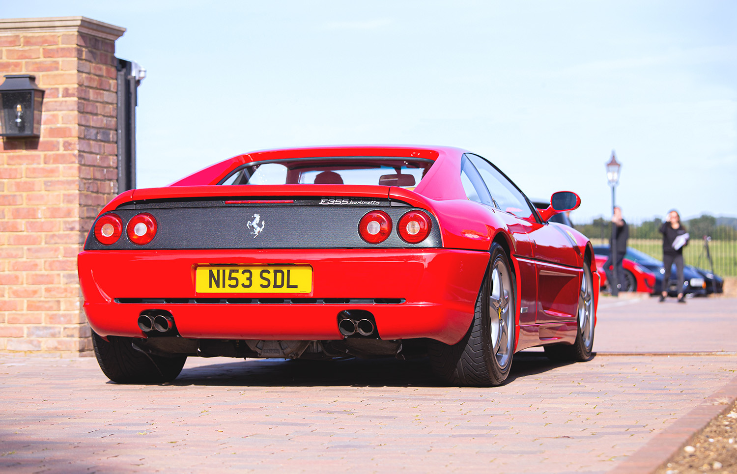 Red Ferrari F355 Berlinetta coupe in England much like the F355 challenge race car wrecked in neighborhood