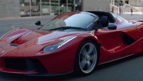 Ferrari LaFerrari Aperta driving through city scape