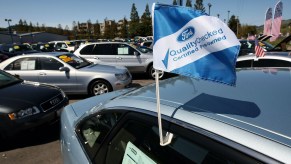 A Ford certified pre-owned car on a sales lot.